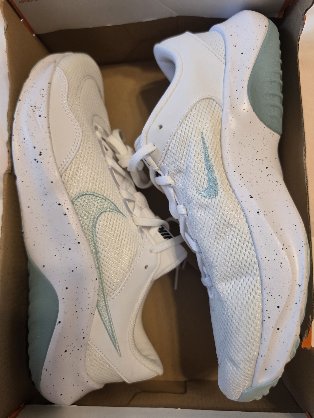 Nike Women’s White Sneakers with Mint Accent